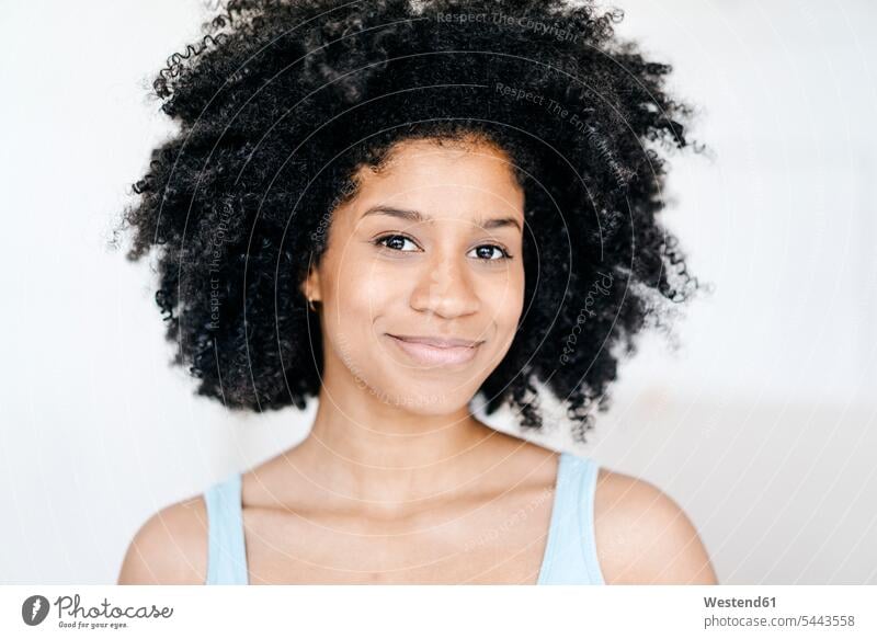 Portrait of a confident young woman carefree females women portrait portraits happiness happy Afro confidence Adults grown-ups grownups adult people persons