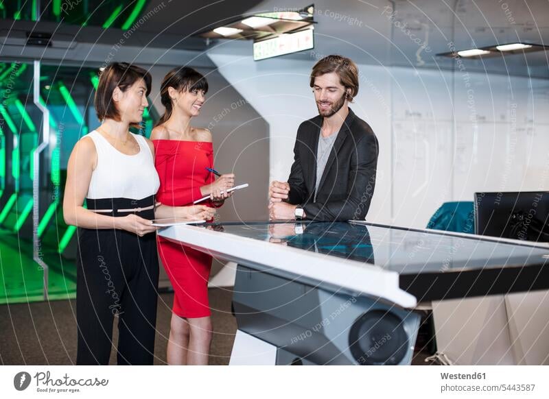 Business people discussing in futuristic office fancy chic the future visionary Office Offices business people businesspeople discussion team professional