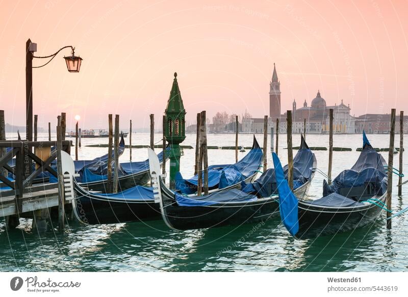 Italy, Venice, gondolas in front of San Giorgio Maggiore typical typically wooden stake wooden stakes landmark sight place of interest water boat boats