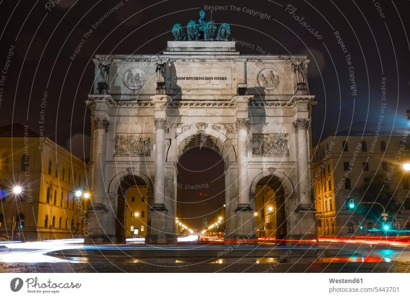 Germany, Bavaria, Munich, North facade of Victory Gate at night quadriga carriage and four Architecture urban scene Siegestor impressive monumental landmark