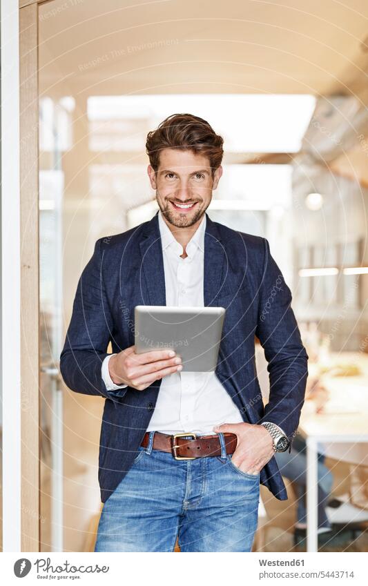 Portrait of smiling businessman using tablet in office digitizer Tablet Computer Tablet PC Tablet Computers iPad Digital Tablet digital tablets Businessman
