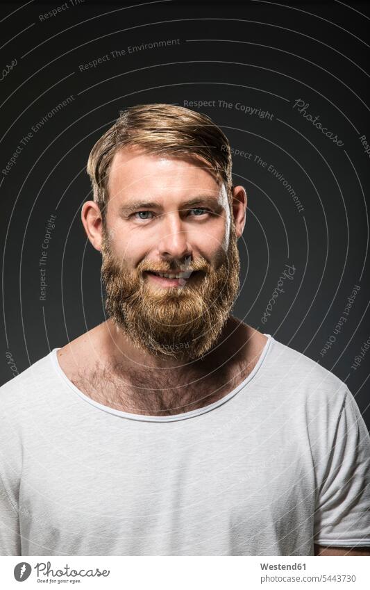Portrait of smiling man with full beard portrait portraits men males smile Adults grown-ups grownups adult people persons human being humans human beings