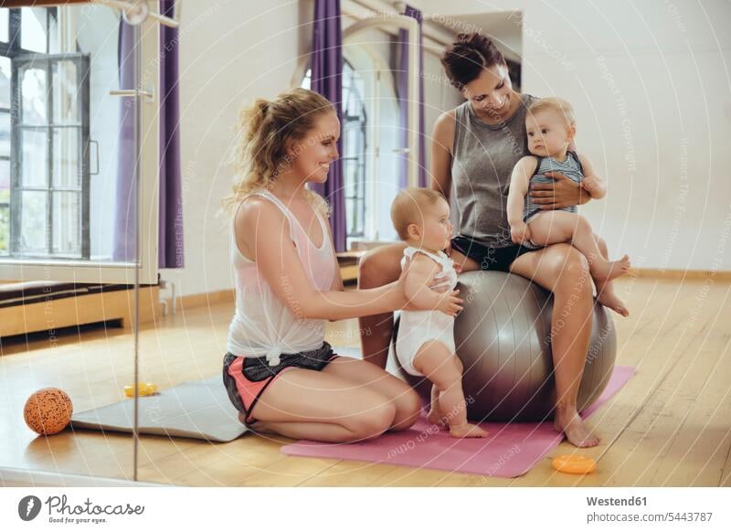 Mothers and babies in exercise room Fun having fun funny exercising training practising baby infants nurselings smiling smile mother mommy mothers ma mummy mama