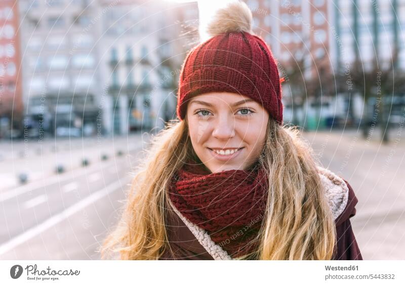 Portrait of smiling teenage girl wearing woolly hat and scarf human human being human beings humans person persons Teen Teenage teenagers Teens female