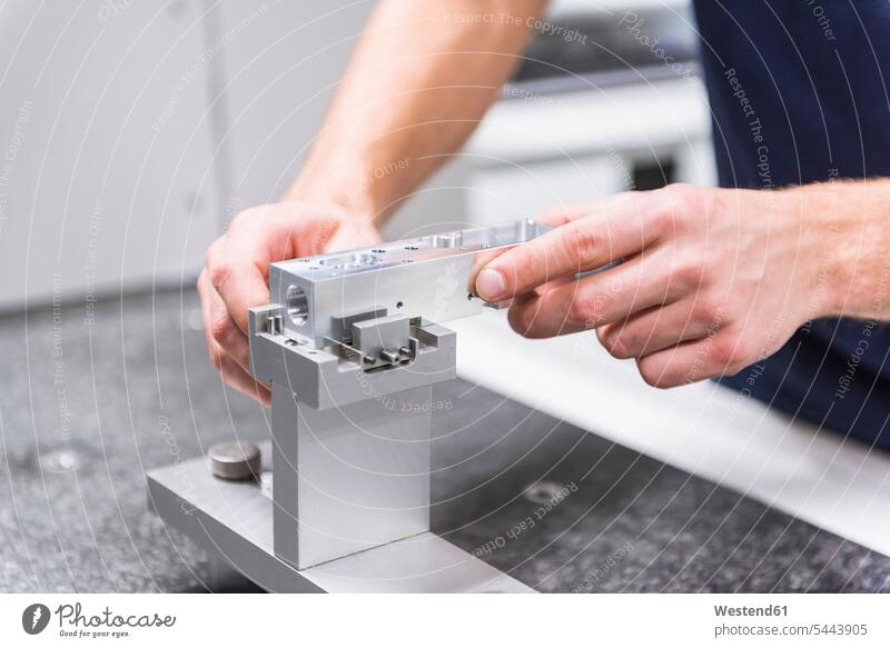 Close-up of a man at a machine in testing instrument room factory factories males working At Work Adults grown-ups grownups adult people persons human being