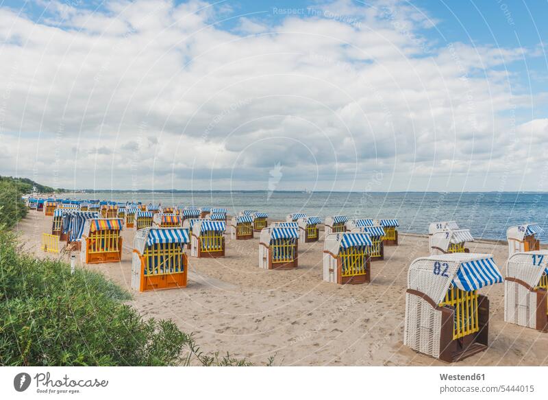 Germany, Timmendorf Beach with hooded beach chairs depression day daylight shot daylight shots day shots daytime Absence Absent cloudy cloudiness clouds