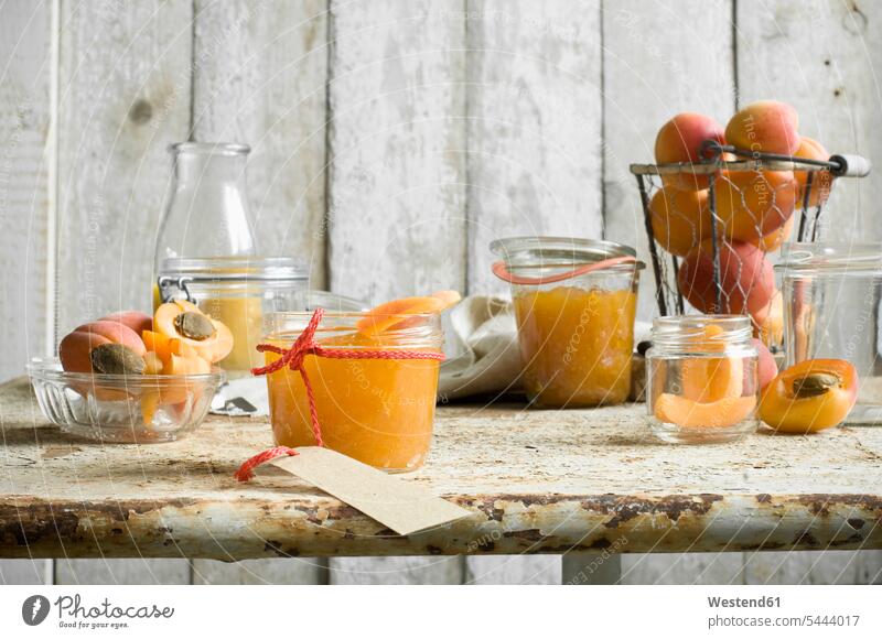 Glasses of homemade apricot jam and apricots food and drink Nutrition Alimentation Food and Drinks Carafe carafes Fruit Juice Fruit Juices half halves halved