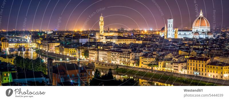 Italy, Tuscany, Florence, cityscape at night seen from Piazzale Michelangelo illuminated lit lighted Illuminating water reflection water reflections Arno