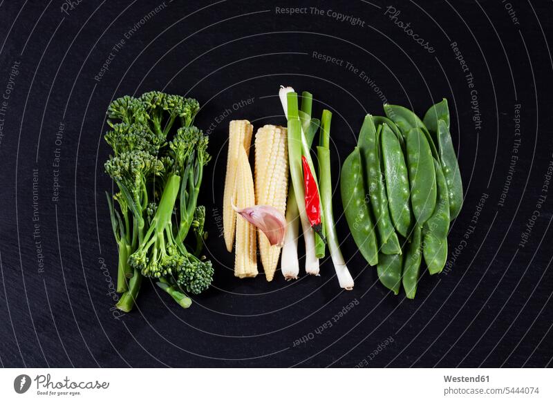 Various fresh vegetables for wok on slate green schist slates healthy eating nutrition ingredient ingredients chili pod chili pods corn cob corncob corn cobs