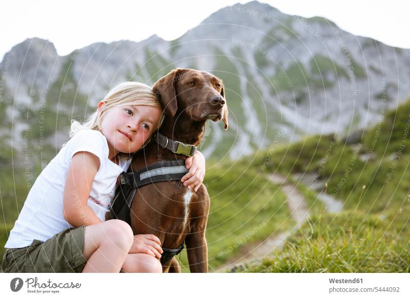 Austria, South Tyrol, young girl with her dog relaxation relaxing female hiker female wanderers Best Friend Best Friends Best Pal meadow meadows sitting Seated