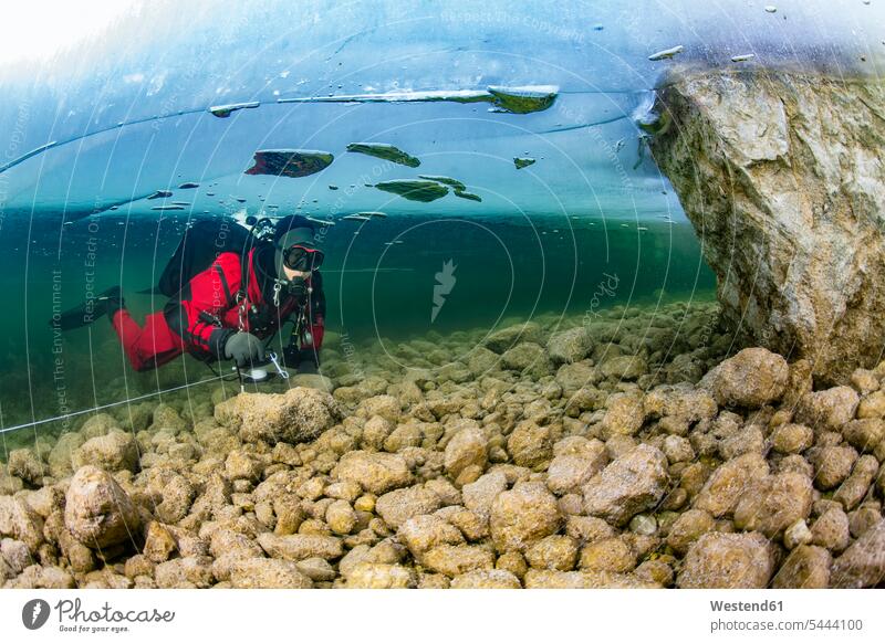 Austria, Styria, Lake Grundlsee, scuba diver under ice floe divers Underwater Diving underwater submerged Under Water underwater shot underwater shots