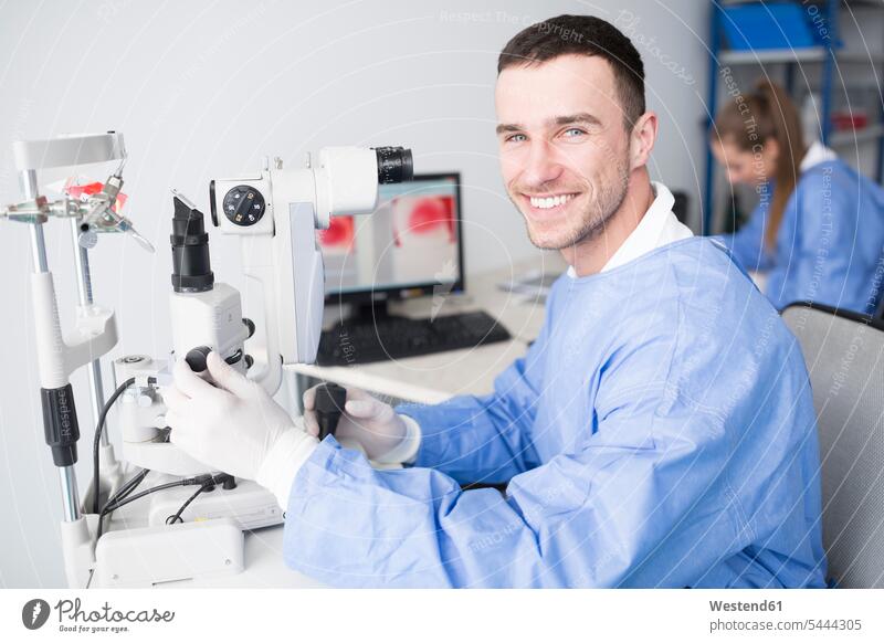Portrait of smiling lab technician in lab microscope microscopes smile laboratory laboratory technician Lab Tech portrait portraits working At Work workplace
