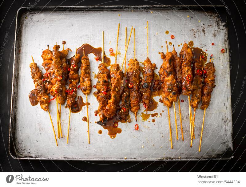 Chicken satay skewers with chili peanut sauce on baking tray food and drink Nutrition Alimentation Food and Drinks fried roast Satay Snack Snacks Snack Food