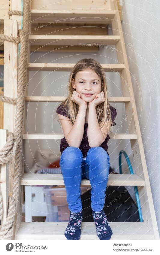 Portrait of girl sitting on ladder of her loft bed females girls portrait portraits child children kid kids people persons human being humans human beings