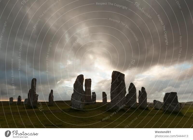 UK, Scotland, Isle of Lewis, Callanish, view to formation of standing stones at backlight cloud clouds cult place ritual place cultic site