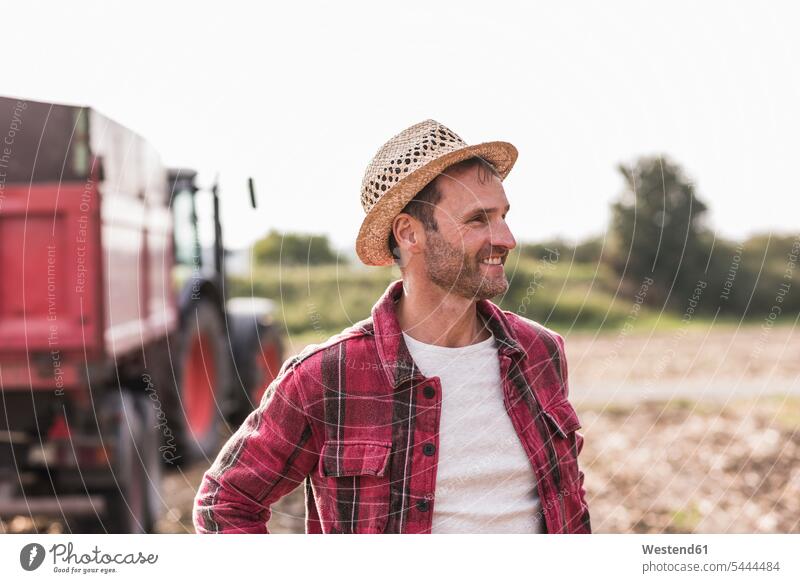 Portrait of confident farmer on field Field Fields farmland man men males smiling smile agriculturists farmers Adults grown-ups grownups adult people persons