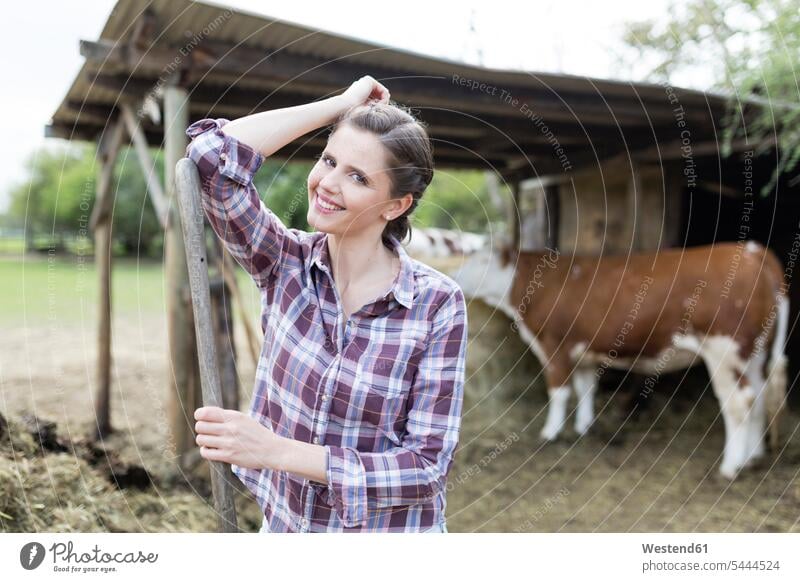Portrait of smiling woman on a farm portrait portraits females women smile agriculture Adults grown-ups grownups adult people persons human being humans