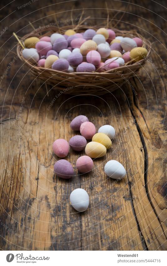 Easter nest of Chocolate Easter eggs on wood food and drink Nutrition Alimentation Food and Drinks Chocolates wooden large group of objects many objects