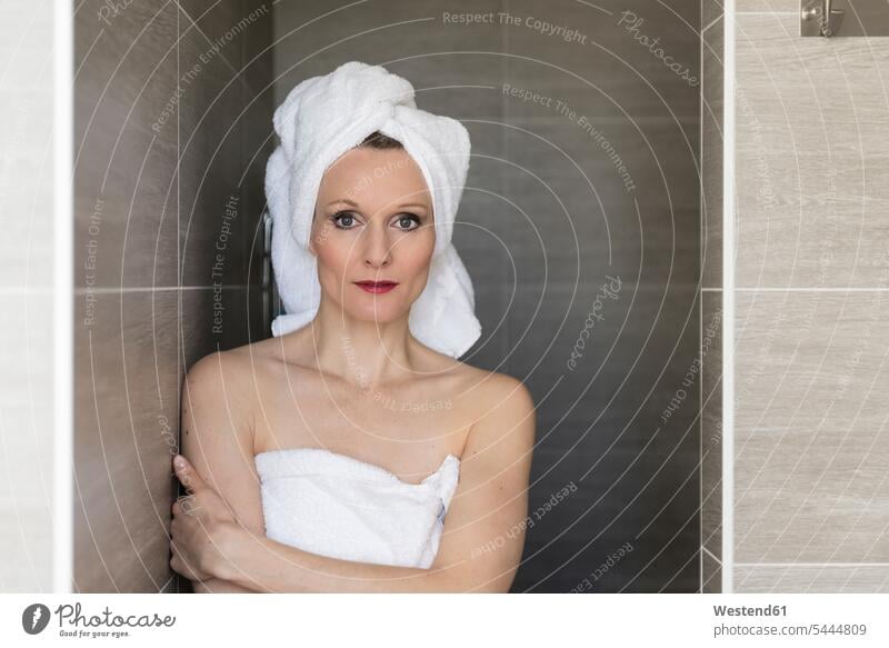 Portrait of smiling woman wearing towels in the bathroom females women Bath portrait portraits Adults grown-ups grownups adult people persons human being humans