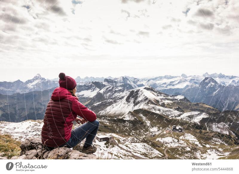 Germany, Bavaria, Oberstdorf, hiker sitting in alpine scenery Seated woman females women mountain range mountains mountain ranges hiking Adults grown-ups