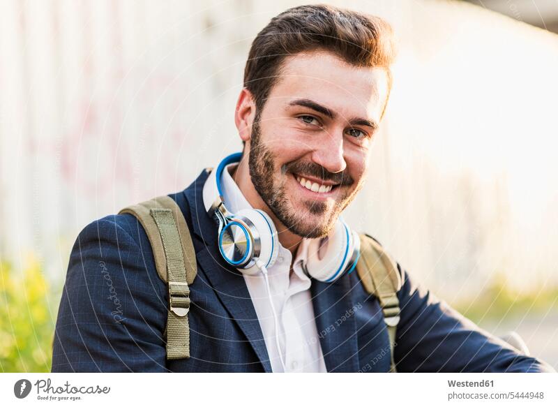 Portrait of smiling young man outdoors portrait portraits men males smile Adults grown-ups grownups adult people persons human being humans human beings