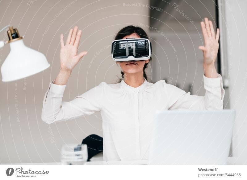 Businesswoman wearing VR glasses in office Virtual Reality Glasses Virtual-Reality Glasses virtual reality headset vr headset vr goggles