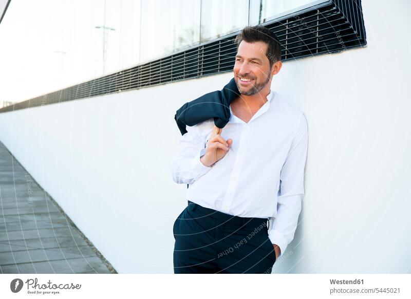 Portrait of confident relaxed businessman outdoors business world business life smiling smile Businessman Business man Businessmen Business men business people