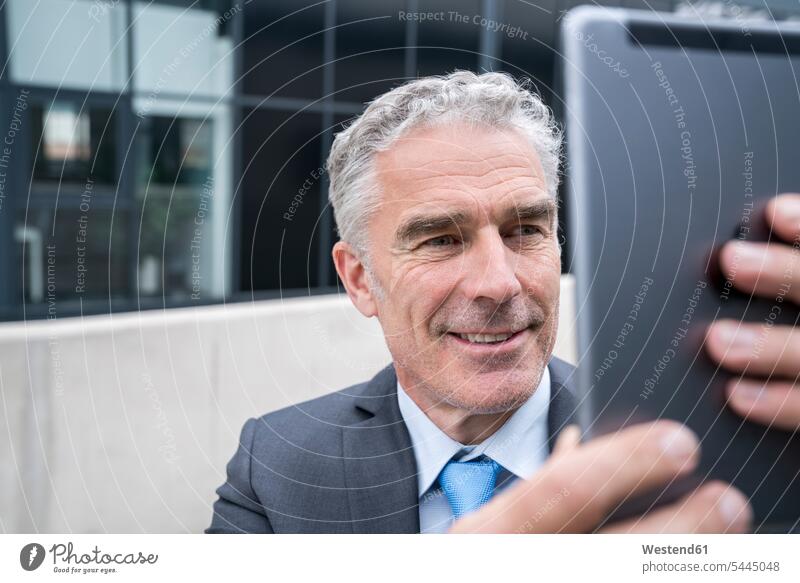 Mature businessman taking a smartphone selfie Video Conference video conferencing tablet digitizer Tablet Computer Tablet PC Tablet Computers iPad