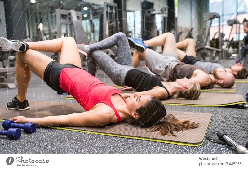 Group of athletes exercising in gym gyms Health Club exercise training practising fitness sport sports Fitness active exercises Recreational Pursuit