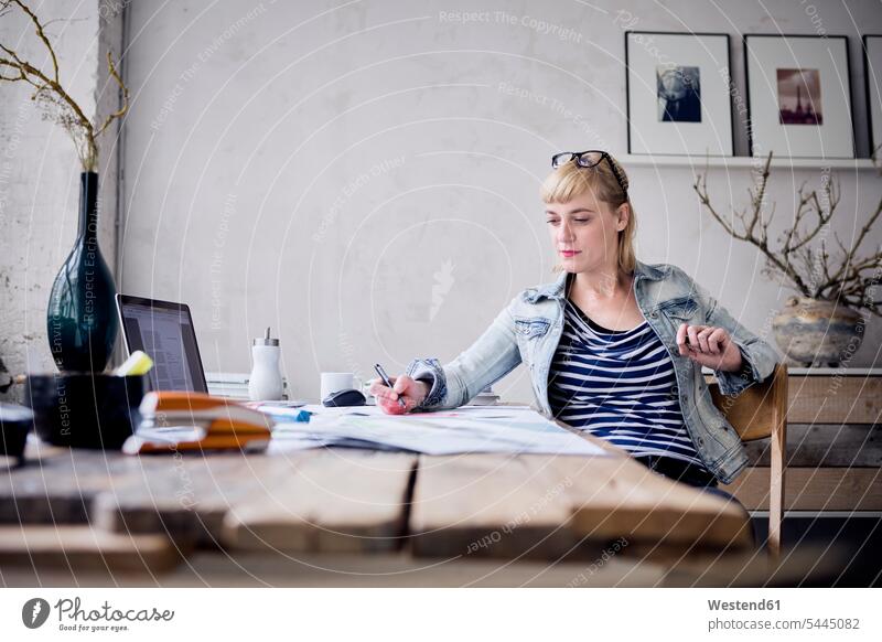 Woman working at desk in a loft lofts freelancer freelancing woman females women Adults grown-ups grownups adult people persons human being humans human beings
