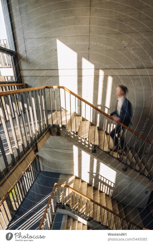 Businessman walking up stairs going Business man Businessmen Business men stairway business people businesspeople business world business life staircase