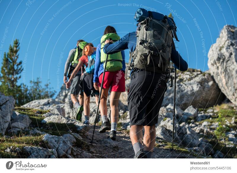 Italy, Friends trekking in the Dolomtes Dolomites Dolomite Alps ascent mountain hike friends active mountaineering climber alpinists climbers Mountain Climber