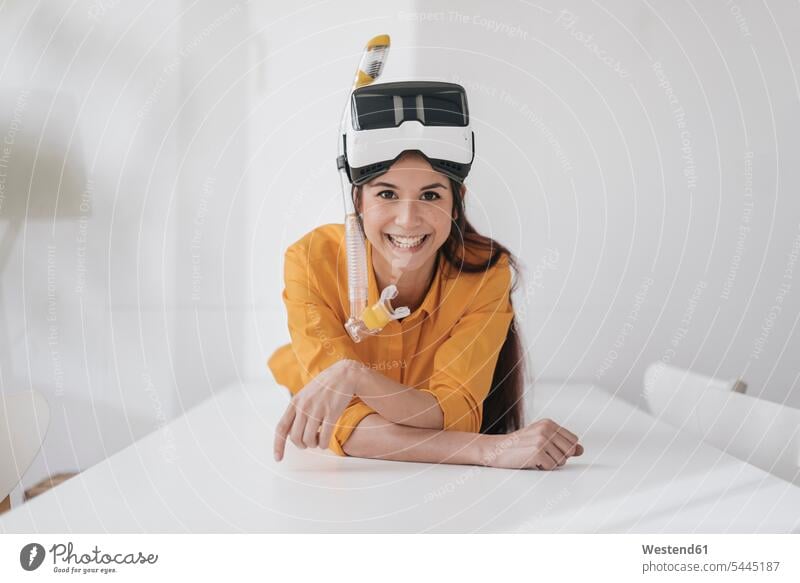 Young woman with VR glasses and snorkel planning next vacation females women young lying laying down lie lying down dreaming Dream Dreams Holidays snorkels