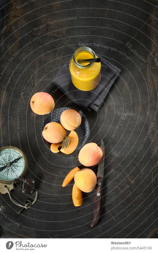 Fruit smoothie and ingredients, apples, apricots, mango nad orange Glass Glasses Fruit Smoothie overhead view directly above top view healthy eating nutrition