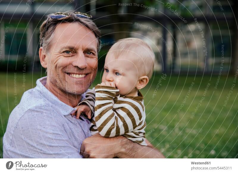 Portrait of happy father with his baby boy son sons manchild manchildren portrait portraits pa fathers daddy dads papa family families people persons
