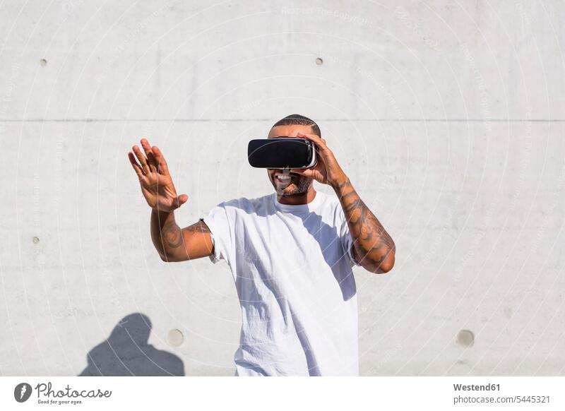 Man wearing Virtual Reality Glasses man men males VR glasses Virtual-Reality Glasses virtual reality headset vr headset vr goggles