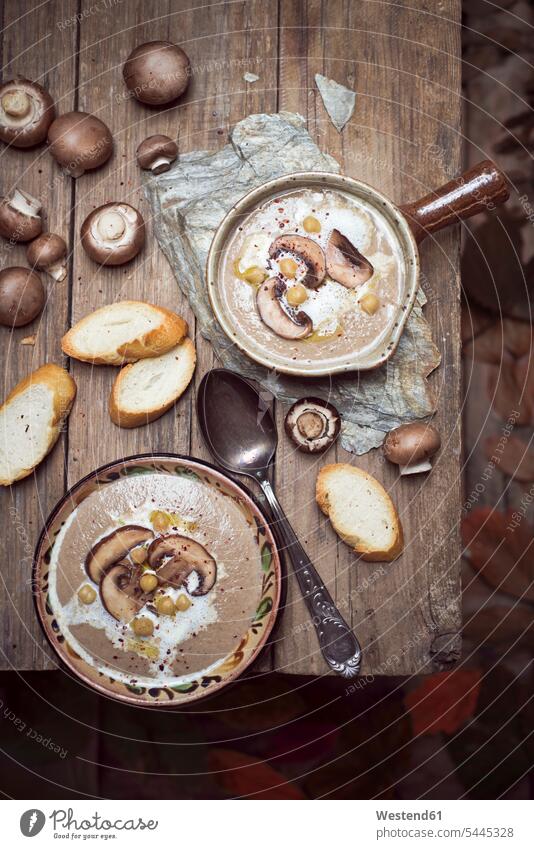 Creme of mushroom soup with chick peas Cooking Pot Pots Cooking Pots wooden rustic hearty savoury food lusty garnished sliced ready to eat ready-to-eat