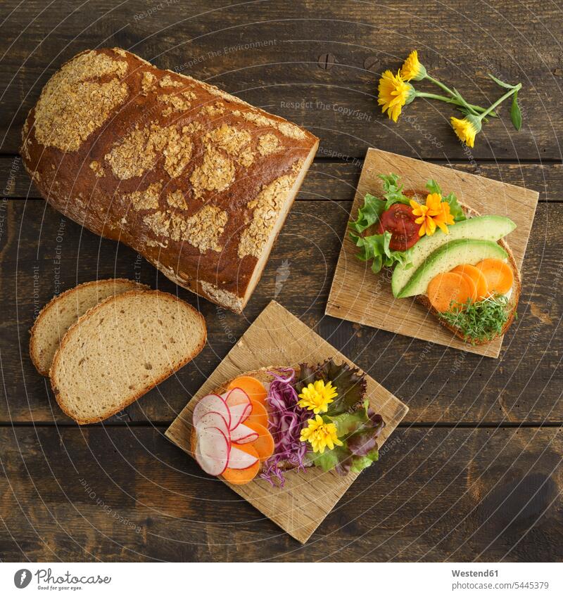 Bread with edible flowers and vegetables food and drink Nutrition Alimentation Food and Drinks garnished flat lay cress cresses Tomato Tomatoes Carrot Carrots