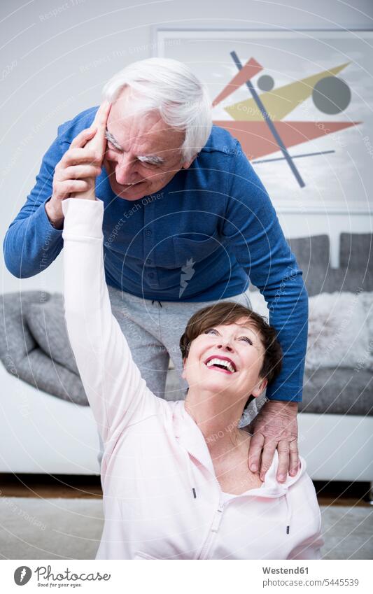 Senior couple exercising together at home caucasian caucasian ethnicity caucasian appearance european Flexibility flexible Fitness fit Activity active exercise