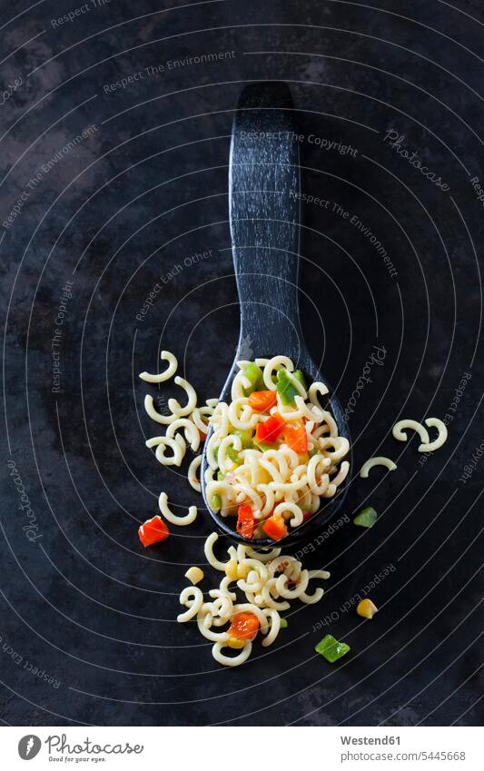 Noodle salad with corn and bell pepper and wooden spoon on dark ground Green Bell Pepper Green Bell Peppers Red Bell Pepper red pepper Red Bell Peppers