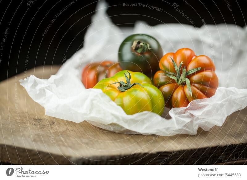 Various Oxheart Tomatoes on paper nobody various different variation focus on foreground Focus In The Foreground focus on the foreground Vegetable Vegetables