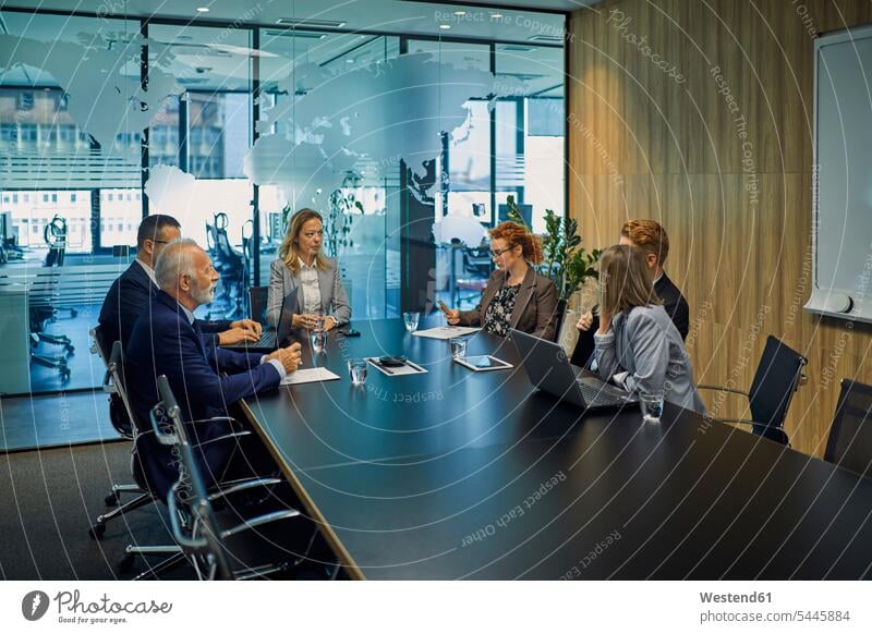 Group of business people discussing in meeting businesspeople office offices office room office rooms talking speaking Business Meeting business conference
