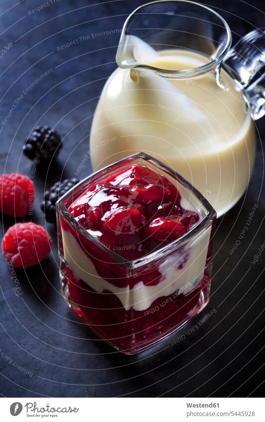 Red fruit compote with vanilla sauce layered in a glass nobody Cherry Cherries Layers Berry berry fruits Berries ready to eat ready-to-eat studio shot