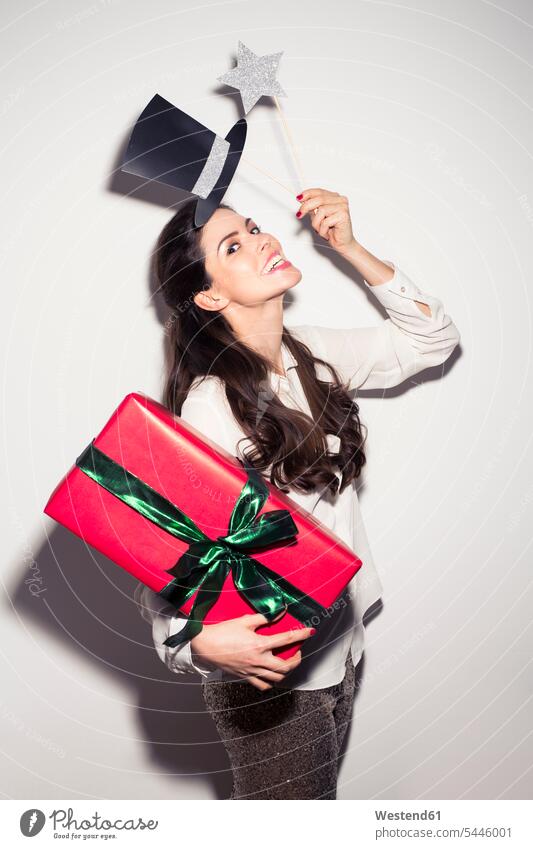Happy young woman in party outfit holding large gift box females women attractive beautiful pretty good-looking Attractiveness Handsome portrait portraits Fun