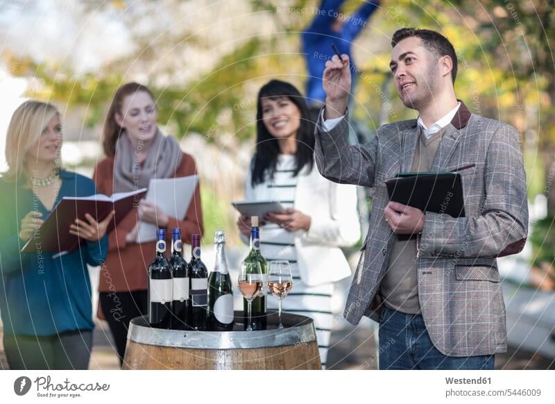 Sales people preparing wine selling event at wine estate salesperson marketing briefing briefings orders Saleswoman saleswomen wine farm Wine Tasting