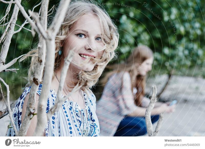 Portrait of smiling teenage girl in nature Teenage Girls female teenagers Teenager Teens people persons human being humans human beings caucasian