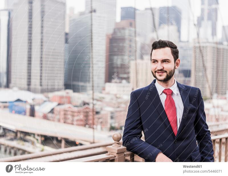 USA, New York City, confident businessman on Brooklyn Bridge smiling smile bridge bridges Businessman Business man Businessmen Business men New York State