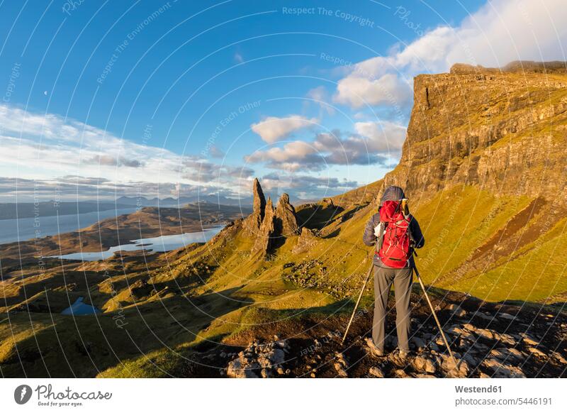 UK, Scotland, Inner Hebrides, Isle of Skye, Trotternish, tourist taking pictures near The Storr coast coastline coast area Seacoast seaside Travel landscape