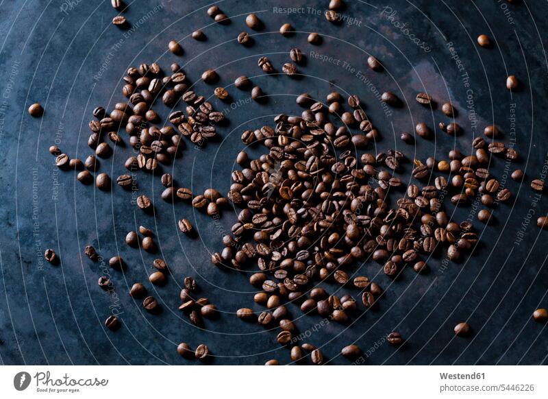 Freshly roasted coffee beans on dark background Coffee Crops close-up close up closeups close ups close-ups aroma flavour aromatic Roasted Coffee Bean