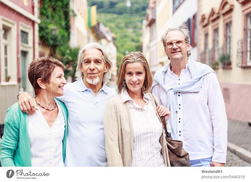 Germany, Heidelberg, portait of senior friends on city trip portrait portraits senior adults seniors old smiling smile friendship Adults grown-ups grownups